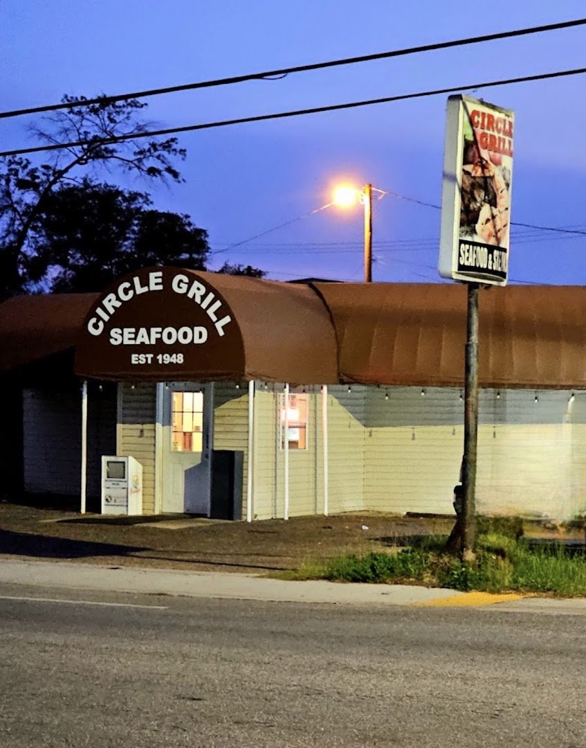 Seafood restaurant dining room with simple tables and chairs.
